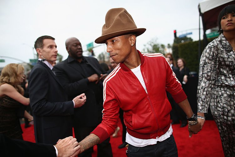 LOS ANGELES, CA - JANUARY 26: Recording artist Pharrell Williams and Helen Lasichanh attend the 56th GRAMMY Awards at Staples Center on January 26, 2014 in Los Angeles, California. (Photo by Christopher Polk/Getty Images for NARAS)